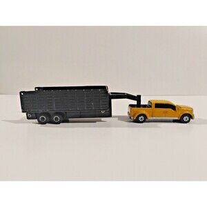 Maisto Ford Mighty F-350 pickup truck, yellow with black dually wheels, by ERTL,